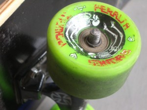 remove the axel nut..don't lose the tiny washer